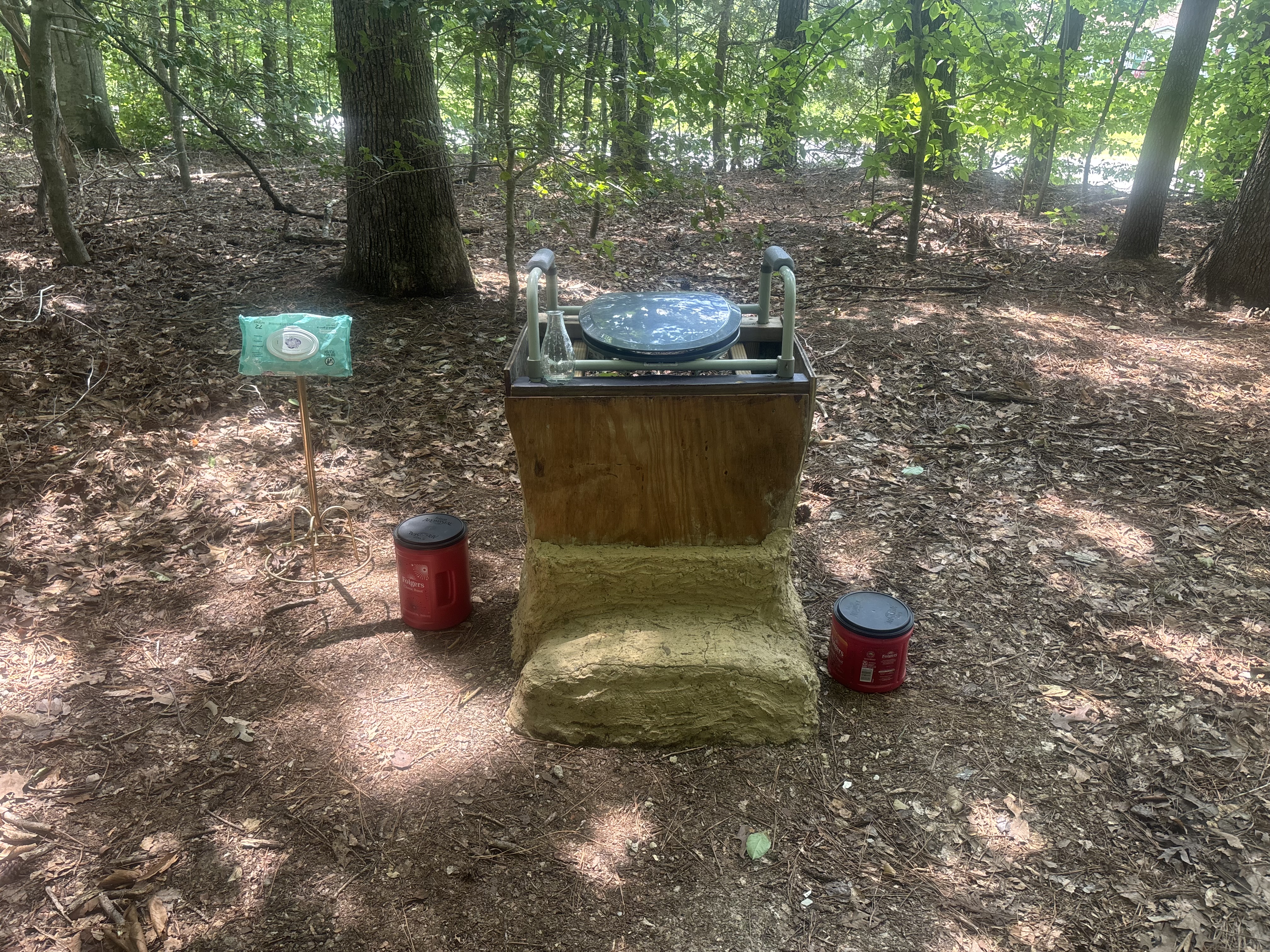 A compoopster — a composting toilet finished in earthen plaster — built as a community project